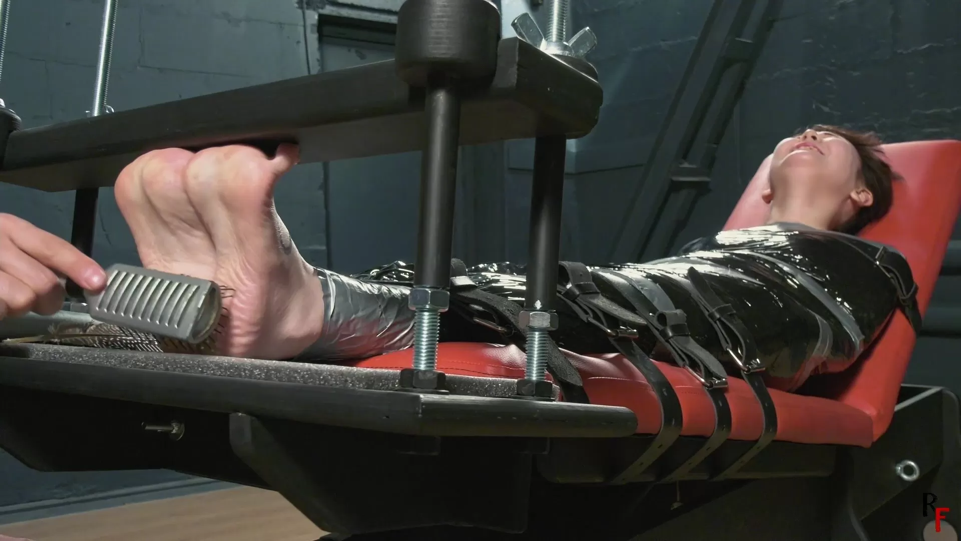 RFStudioProduction – Madoka – Asian tiny feet tickling in a foot arching devic.webp