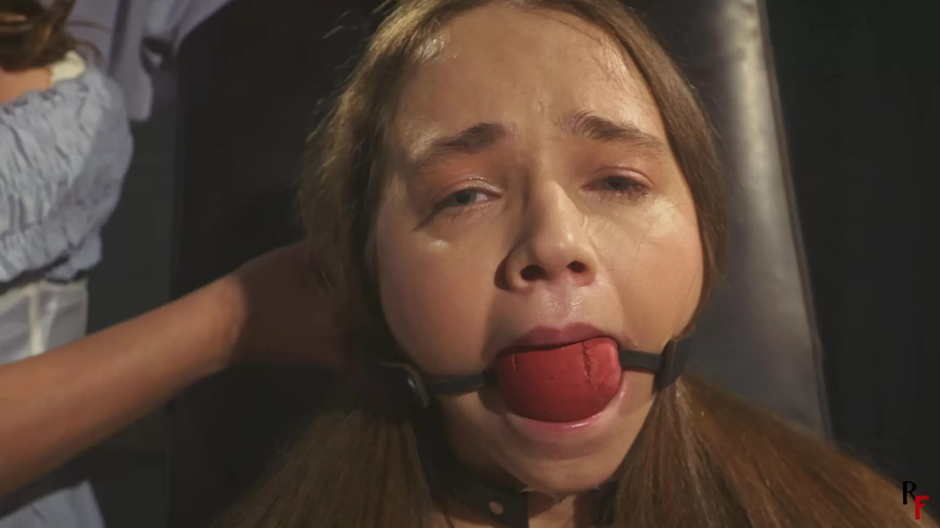 RFStudioProduction – Arina – Foot Tickled by Patty in Stocks with BallGag, Tie.webp