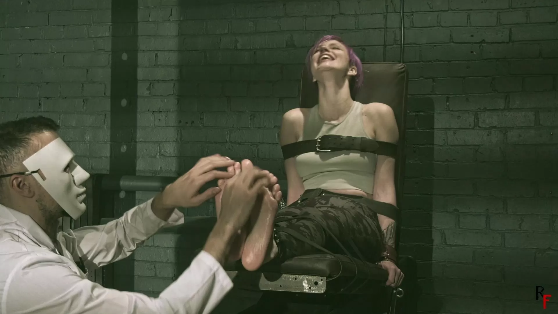 RussianFetish – Psy Helmet – The story how Mad Doc made Astrid his tickle toy..webp