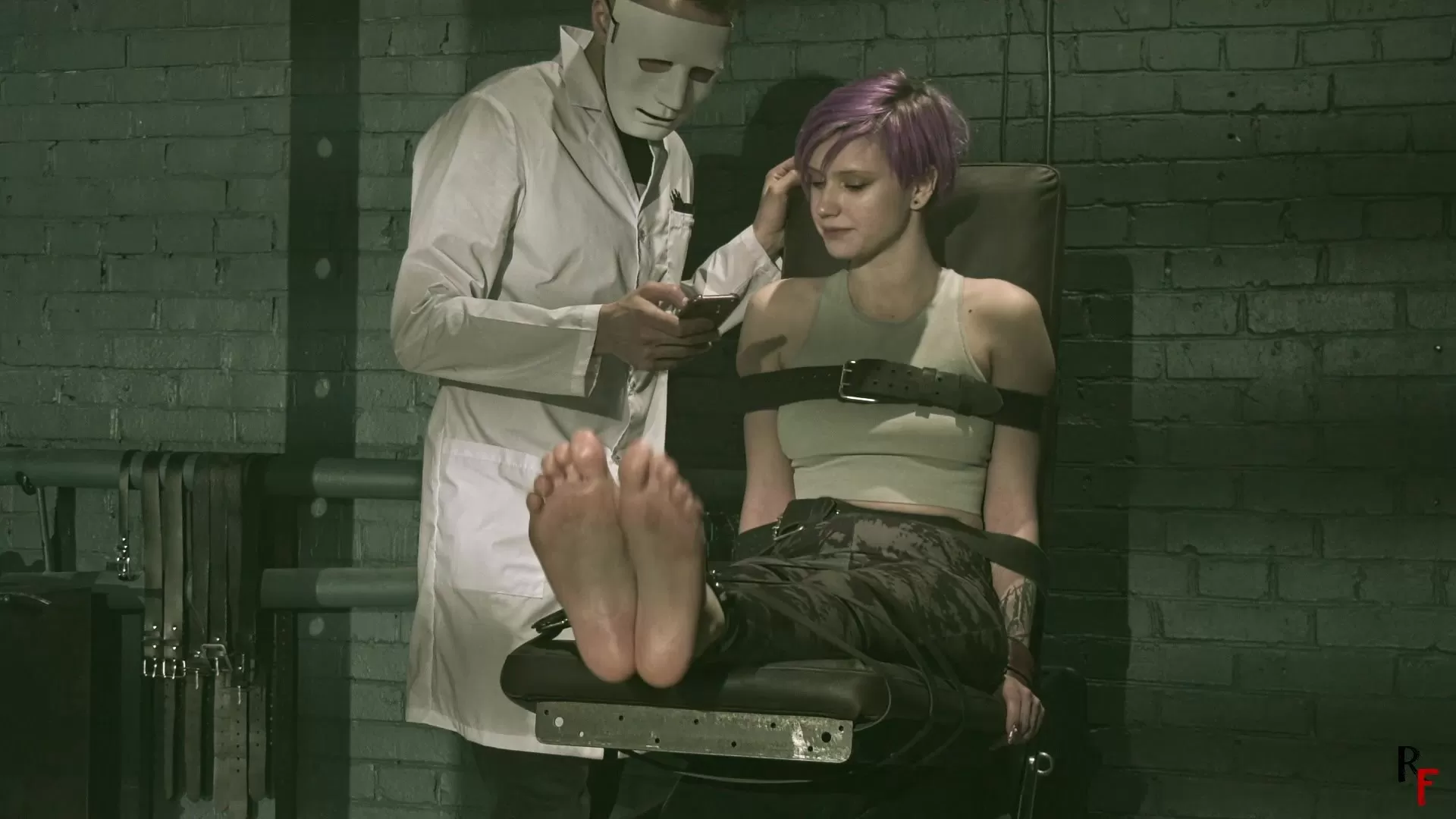 RussianFetish – Psy Helmet – The story how Mad Doc made Astrid his tickle toy..webp